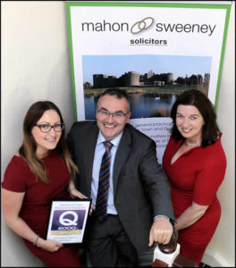 Mahon Sweeney Solicitors holding Q6000 Gold Standard Award